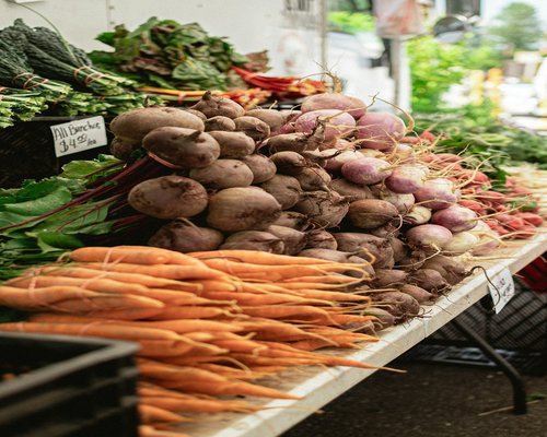 Close up of fresh vegetables and fruits purchased from a local farmers market